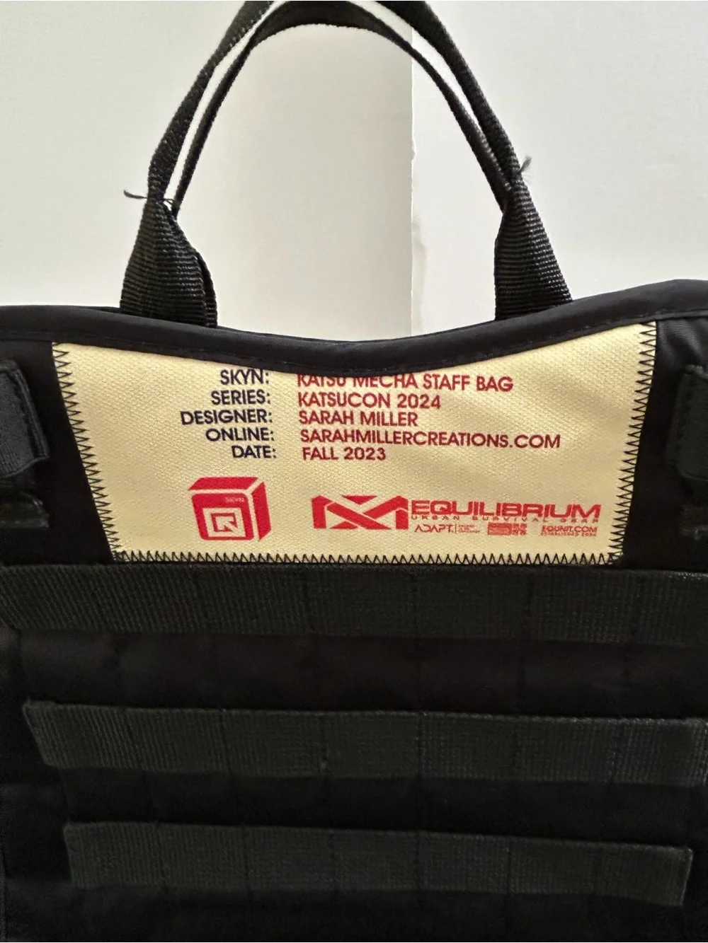 Equilibrium Katsucon 2024 Mecha Anime Staff Bag designed by Sarah Miller